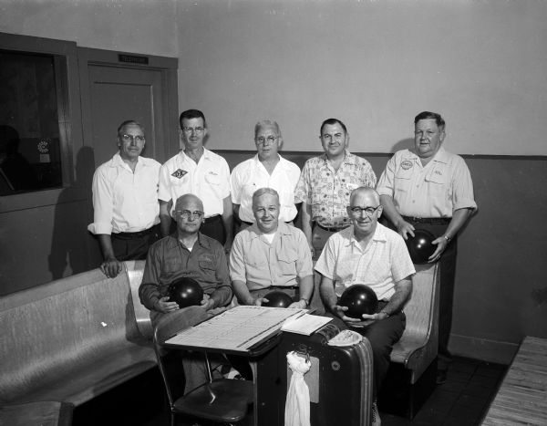 Group portrait of the members of the Craftsman Bowling League as they launch the 1956-57 bowling season.