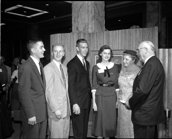 Four Madison incoming freshmen and transfer students are greeted by Rosa Fred, and University President E.B. Fred, at the Memorial Union. The students, left to right, are: Ted Cole, Rollie Willan, Carl Zielke, and Judy VanderMeulen.