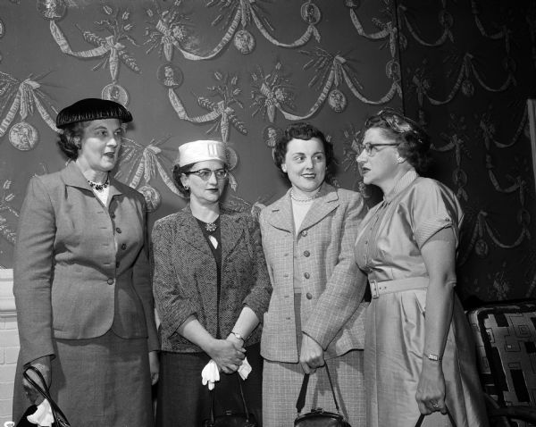 The activities at the Wisconsin Title Association Wives Program included a bus tour of Madison, a banquet, and a guided tour of the Wisconsin State Capitol. Shown from left are: Mrs. Harold McLean, Mt. Pleasant. Iowa; Mrs. Thomas Holstein, LaCrosse; Mrs. John Ondrasek, Fond du Lac; Mrs. Robert Kniskern, Rhinelander.