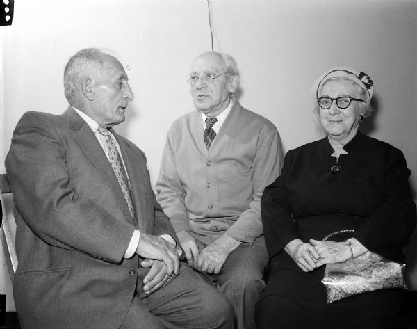 Joseph Rozansky, Joseph Vein, and Bessie Vein (left to right) enjoy conversation at the monthly afternoon party put on by the Council of Jewish Women at the Congregation Adas Jeshurun.