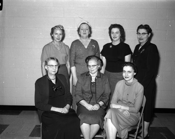Group portrait of the new officers of the West Side Businessmen's auxiliary. Seated left to right: Caroline Blawusch, Harriet Williams, Ruth Egan. Standing are: Mrs. Marvin Bump, Eleanor Fox, Normalee Olson, and Alyce Draper.