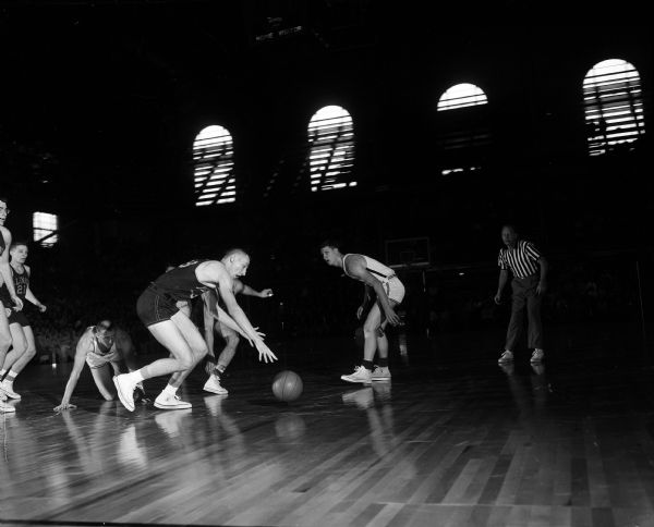 Action shot taken during the University of Wisconsin vs. University of Illinois basketball game in the University of Wisconsin-Madison Field House.