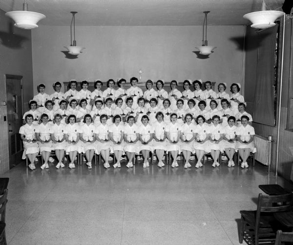 Group portrait of fifty St. Mary's Hospital School of Nursing students following a ceremony in which they received their nursing caps.