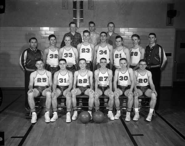 Group portrait of the Waunakee High School basketball team.
