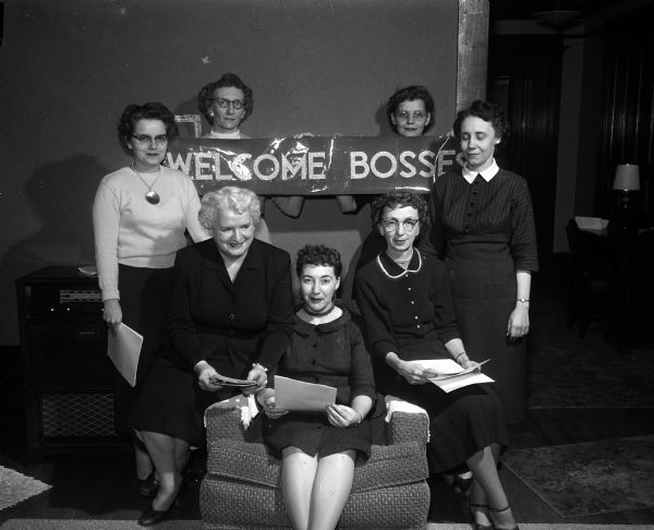 The members of the committee for the annual Bosses' Night of the Insurance Women of Madison meet to make arrangements. Seated are Miss Maida Dunn; Miss Helen Hendrickson, president of the group and Mrs. Al (Leila) Pertzborn, general chairman of the party. Standing are: Miss Barbara Thompson, Mrs. L.B. (Arlene) Pease, Mrs. E.E. (Persis) Van Meter and Mrs. Ralph Whitesitt.