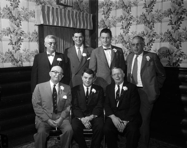 Group portrait of officers and committee members who arranged the annual Ducks Unlimited banquet. Front row: C.A. Gross (Green Bay); Toby Sherry; Arthur Bartley (New York), speaker. Back row: Jack Anderson, Ozzie Veerhusen, Dick Johnson, and Stanley Johnson.