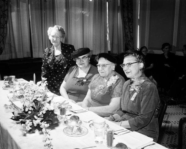 Mrs. Gertrude M. Edwards (far right), Iroquois, South Dakota, national president of the Woman's Relief Corps, was guest of honor at a luncheon and reception at the Hotel Loraine. Left to right are Mrs. Della Alexander, 57 Waubesa Street, president of the Madison WRC, No. 37; Mrs. Pauline Bursek, Manitowoc, national director of the Junior WRC; Mrs. Freda Schellenberger, Baraboo, department president, and Mrs. Edwards.