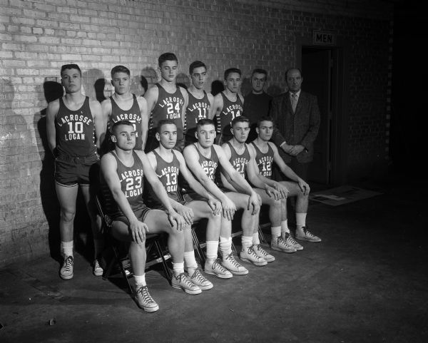 Group portrait of the La Crosse Logan High School boy's basketball team. The team will be participating in the state high school basketball tournament in the field house, located on the University of Wisconsin campus.