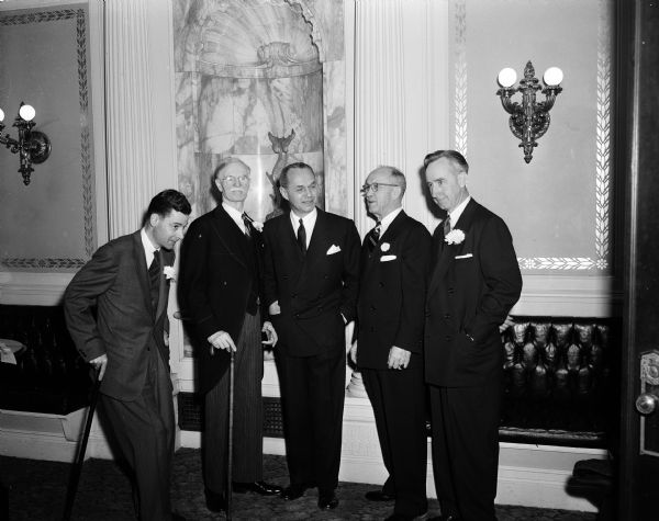 Group portrait of Wisconsin's five constitutional officers at the swearing-in ceremony to begin their new two-year terms. Left to right: Lieutenant Governor George M. Smith, Secretary of State Fred R. Zimmerman, Governor Walter Kohler, State Treasurer Warren R. Smith and Attorney General Vernon W. Thomson.