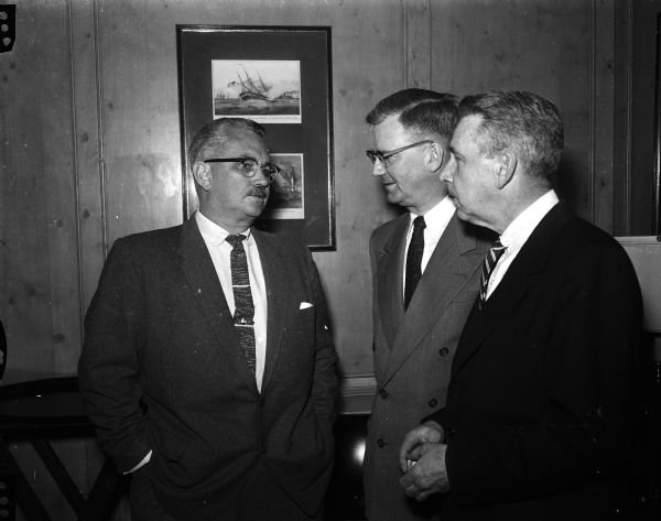 Hodding Carter (left), Pulitzer prize-winning editor of the <i>Delta Democrat-Times</i> in Greenville, Mississippi speaks with Supreme Court Justice Emmert L. Wingert, center, and Law School Dean John Ritchie at the Simon House. Carter was the featured speaker at a luncheon given in his honor by <i>Wisconsin State Journal</i> publisher Don Anderson.