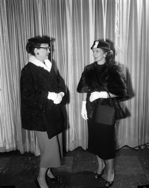 Mrs. Jerry Schaldach of Middleton models a Persian lamb coat which she styled in a fur remodeling class at Madison Vocational and Adult School, 211-213 North Carroll Street.