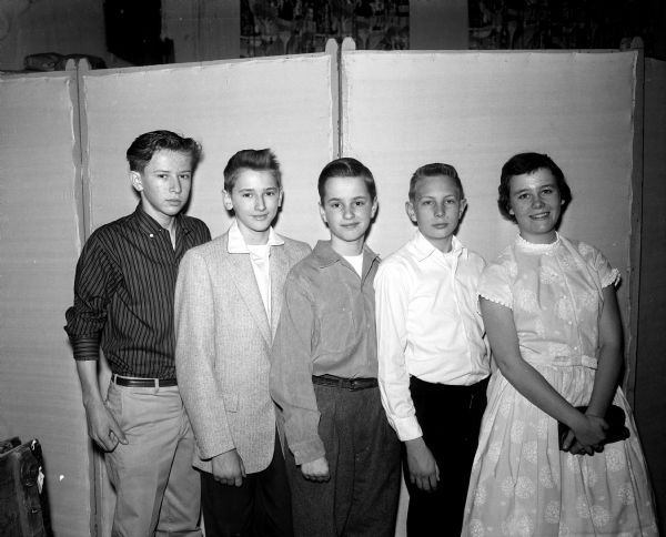 Group portrait of five Madison public school students, winners of the 1957 Helen Farnsworth Mears art contest. Left to right: Dave Olson, East High; Allen Brager, West High; Newell Gustafson, West High; Ronald Quisling, West High and Mary Anderson, East High. They were honored at a meeting of the Madison Woman's Club.