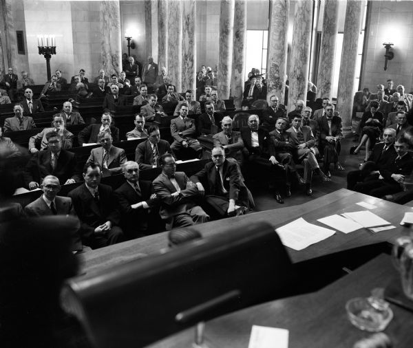 The Wisconsin State Legislature listens to an address from Governor Walter J. Kohler, Jr. The State Senators are seated in the first row, including Melvin Laird (at the aisle).