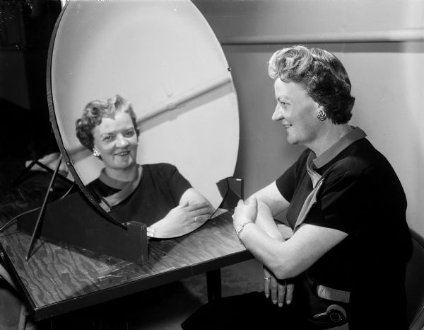 Mrs. Charles W. Conger, 400 Douglas Trail, had her hair cut and re-styled, now with a "larger" hairdo.