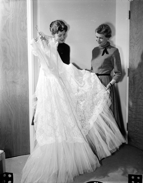 Barbara Noel Wellman, right, looking at a wedding gown as a possibility for her June 29 marriage to Thomas Kivlin.
