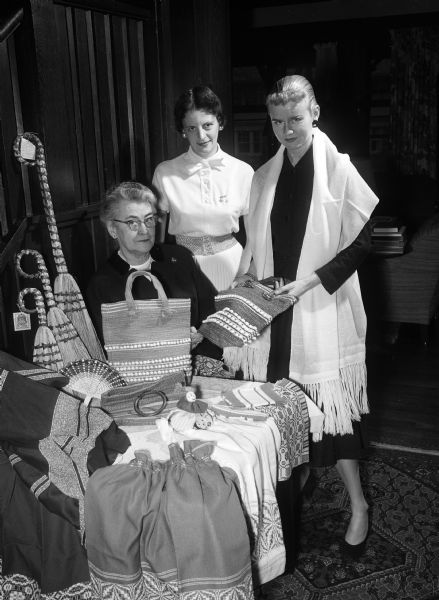 Three Phi Beta Phi alumnae members posing with Arrowcraft products. The sorority will be selling the products to benefit the Settlement School of Gatlenburg, Tennessee. Left to right: Margaret Schorger, Rose Mary Rupnow, and Matilda Thvedt.