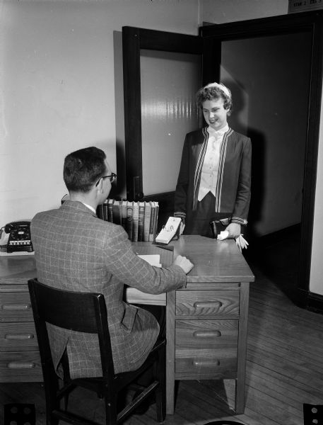 Virginia Strickland, a senior at East High School, demonstrating making a good first impression at a job interview by smiling warmly, maintaining an alert and interested attitude, and dressing conservatively.