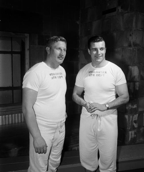 University of Wisconsin alumni football game coaching staff pictured here include Ken Huxhold and Don Kindt.