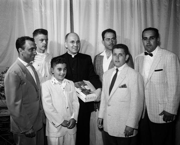 Athletes honored at a St. Joseph Grade School banquet include, front row, left to right: Tony Balsamo, most improved player in softball and Joe Prevenzane, softball captain. Shown with the athletes are back row, left to right: Joe Masino, Dick Stoffels, the Rev. Gabriel Hinkes, Tom Guastello, and Joe Balsamo.