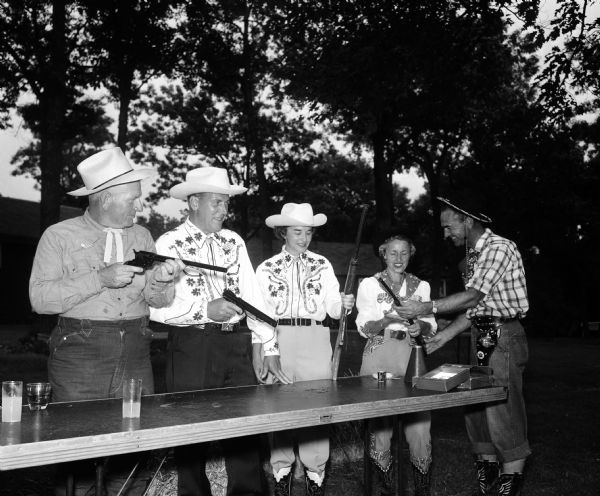 Shooting gallery at Blackhawk Country Club Western Ranch Party. Shown left to right: Fred Marsh, Maurice Wilson, Neoma Wilson, Irene Marsh, Howard Radder.