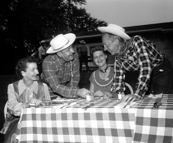 Costumed party-goers enjoy the Blackhawk Country Club Western Party. They include, from left: Patricia Werner, Julius Werner, Dorothy Bury, and Carl Bury.