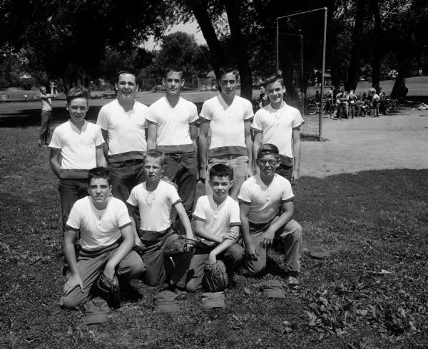 Group portrait of the Shamrocks boys baseball team who won the West Midget Wingra League pennant. 
Front row: Jack Renk, Pete Fray, Jack Sweeney and John Heim.
Back row: Dennis Sweeney, Rick Lynaugh Dave Caulum, Tom Knechtges, Pete Krug.
Absent from the picture: John Kepke, Jerry Ruhlich and Paul Fleury.