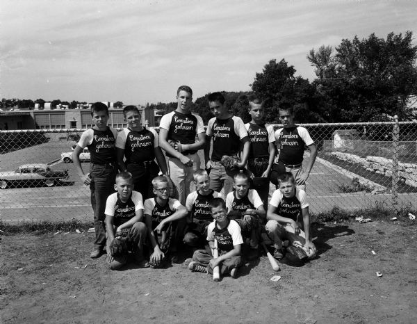 Group portrait of the Comstock-Johnson boys baseball team that is in the semi-finals of the West Side Midget championship series after winning the Cherokee No. 1 League pennant.
Seated is batboy Dave Wilson. Kneeling: Fred Moll, Roger Steeper, Mike Williams, Jim Schlutter, Tim Comstock. Standing: Doug Torrie, Manager Tom Fuss, Bud Roden, Ray Weatherwax, Mike Remington and Pete Jackson.