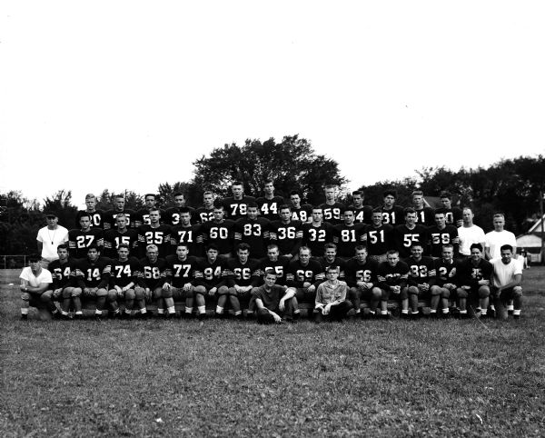 Group portrait of the East High School football team.