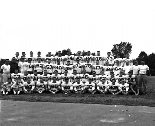 Group portrait of the West High School football team.