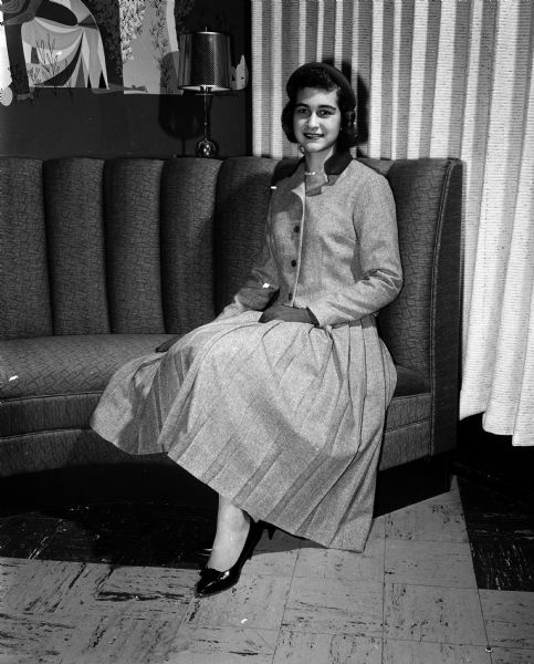 Beverly Richels, a student at Madison East High School, participates in the Vogue fashion show designed as a clinic for teenagers who like to sew. She models a flannel suit with a boxy jacket and pleated skirt.