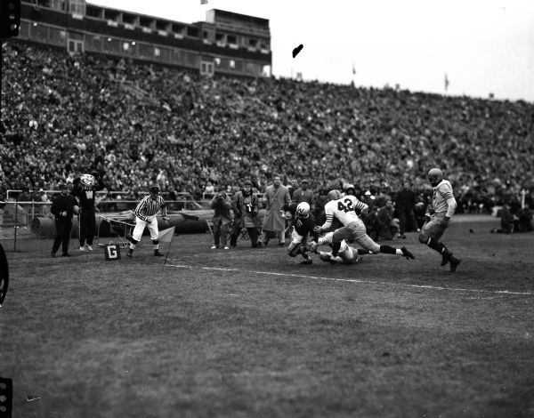 Wisconsin player Ron Steiner (#15) nears the Illinois end zone for a touchdown during the University of Wisconsin vs. Illinois football game.