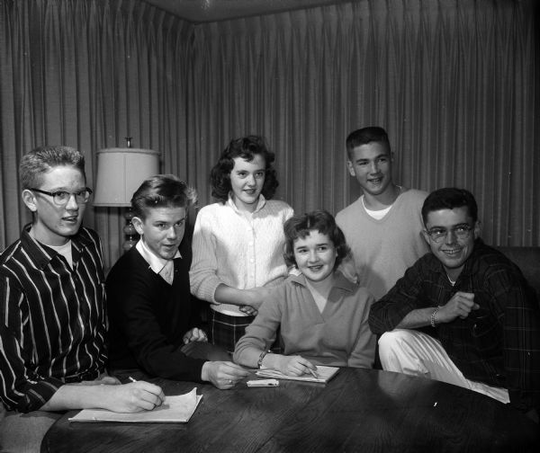 Group portrait of six teenage children of Blackhawk Country Club members who are planning the teen dance. Left to right, they include: Eric Peterson, Dennis Pearson, Sharon Reynolds, Patrica Radder, Perry Armstrong, and Dick Quintana.
