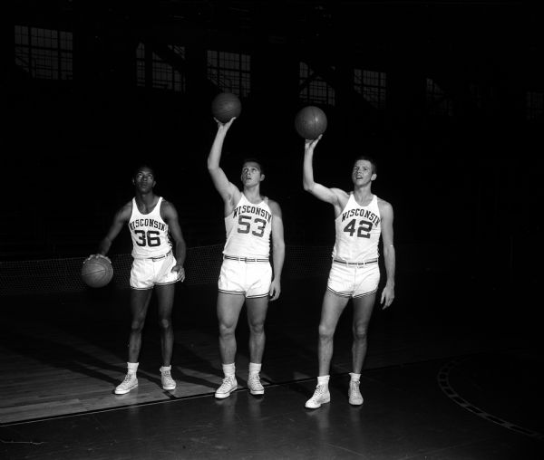 Portrait of three University of Wisconsin freshmen basketball players wearing uniforms with Nos. 36, 53, and 42.