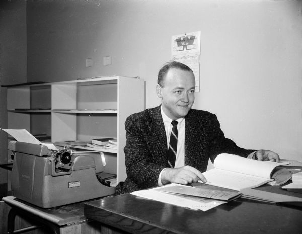 Jerry C. McNeely, associate professor of speech at the University of Wisconsin, has had two major television plays produced, one on "Studio One" and the other on "Climax."  He is pictured in his office with a typewriter.