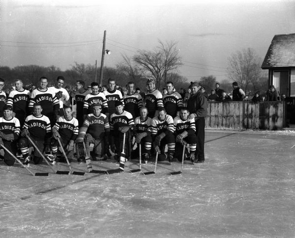 Group portrait of the Madison Cardinals ice hockey team taken outdoors at Vilas Park.