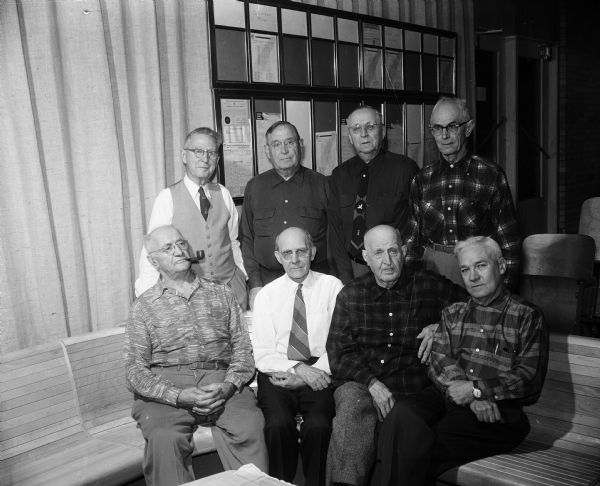 A group of the older bowlers of the Knights of Columbus league at the Dream Lanes on Cottage Grove Road on Madison's east side. Seated, from left, are: Peter Kuehn, Henry Knobeck, William Ryan, and Pete Reif. Standing, from left, are: Joe Rupp, Joe Wirka, Bill Paltz, and Carl Minch.