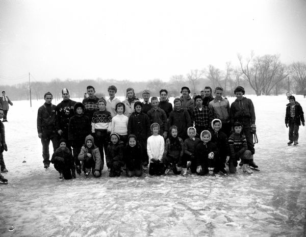 Group portrait of the 1958 city speed skating champions who won their races in the finals at Vilas Park.