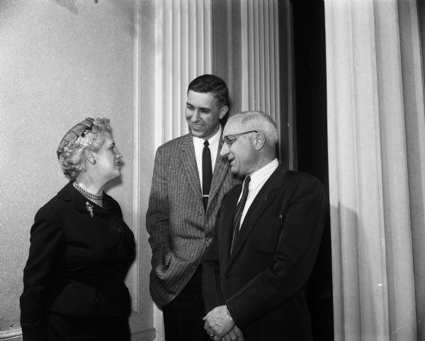 Three board members confer at the annual meeting of the United Community Chest. From left are: Mary Johnson, Phillip C. Stark, and John R. Wrage.