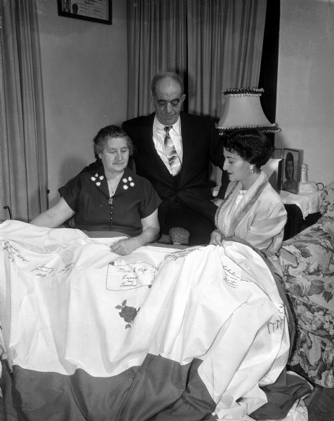 When Mr. and Mrs. John (Rosie) Capaci of 1025 South Park Street observed their 42nd wedding anniversary, they were presented with a gift from their daughter, Mrs. Charles (Josephine) Lanman of 606 University Avenue. The gift was a five-yard green and white tablecloth embroidered with the names of the Capacis' ten children, their sons-in-law, and grandchildren - a total of thirty-nine names.