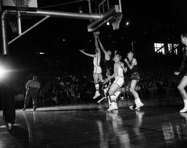 Walter (Bunky) Holt of the University of Wisconsin scores a basket in a televised Big 10 basketball game against Minnesota. Minnesota won the game with a score of 71-66.