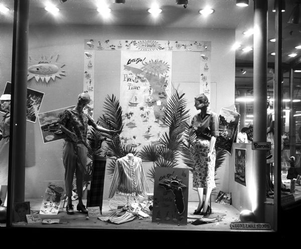 The display window of Baron's Department Store is decorated with Florida vacation fashions.