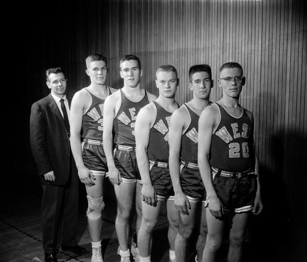 The starting five for Madison West High School basketball team compete in the state tournament. They include, from left, coach Jim Stevens, Fritz Kruger, Tim Harrington, Jim Bakken, Howard Mazur, and Roger Wiebe.