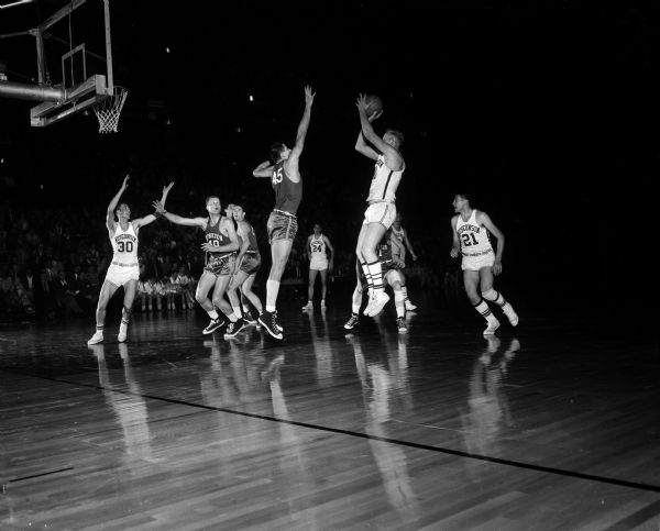 George Maddock makes a shot during a University of Wisconsin basketball game against Northwestern University.