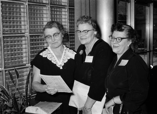 Three members of the Homemaker's Chorus who sang during the annual University of Wisconsin's Farm and Home Week. From left to right are: Mrs. Henry Peters and Mrs. Ella Vandervest of New Franken, and Mrs. Harry Benecke of Denmark.