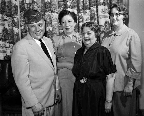 Members of the local Marion Cranefield auxiliary of the Veterans of Foreign Wars at the banquet honoring the president of the national auxiliary. From left are: Don Wonn, post commander; Mrs. Helen Gronlid, auxiliary president; Josephine Brahm, banquet chairman; and Mrs. Leone Morrisey, banquet arrangements chairman.