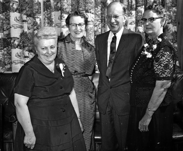 A special tribute was paid to auxiliary hospital chairmen during the banquet honoring the national auxiliary president of the Veterans of Foreign Wars. From left are: Mrs. Chester Jorzak of Lyndon Station, auxiliary representative at the Veterans Administration hospital at Tomah; Mrs. Arthur Tell of Lannon, hospital director for the auxiliary; Dr. Morris C. Thomas, manager of the Veterans Administration hospital in Madison; and Mrs. Ethel Mathews of Madison, auxiliary hospital chairman at the VA hospital in Madison.