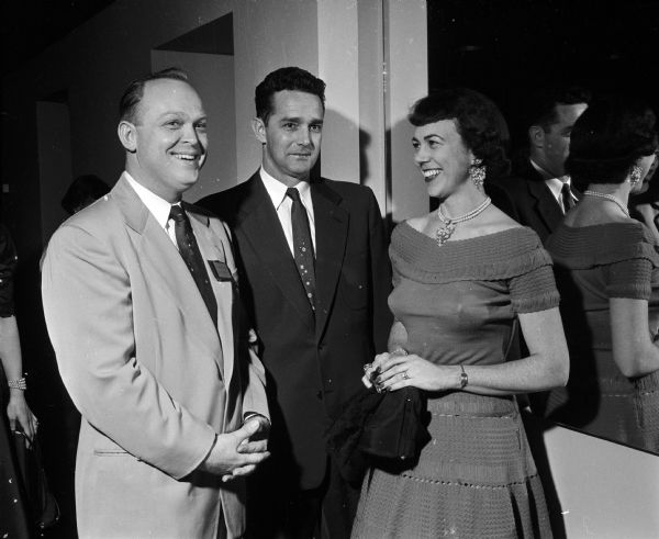 Group portrait of three attendees at the Combo Club dinner dance at the Nakoma Country Club. They include, from left: Kenneth Johnson and Wayne and Margaret Weber.
