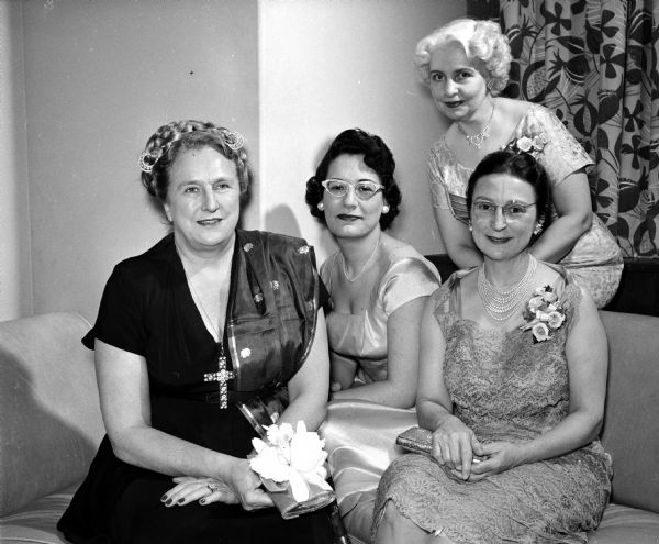 Four women attend the annual banquet for members of Matrix, an organization for women journalists. They include, from left to right: banquet speaker, Esther Van Wagoner Tufty, Washington newspaper woman; Leah Nathanson, Chicago, president of the Theta Sigma Phi journalism sorority; Hazel Van Wagenen, who gave the "town response" and Ineva, wife of University of Wisconsin vice-president, Ira Baldwin.