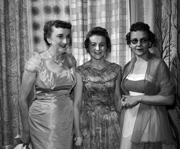 Three women attend the annual banquet for members of Matrix, an organization for women journalists. They include, from left: Gertrude Anderson; Geraldine, wife of Madison mayor Ivan Nestingen; and Louise Schmidt.