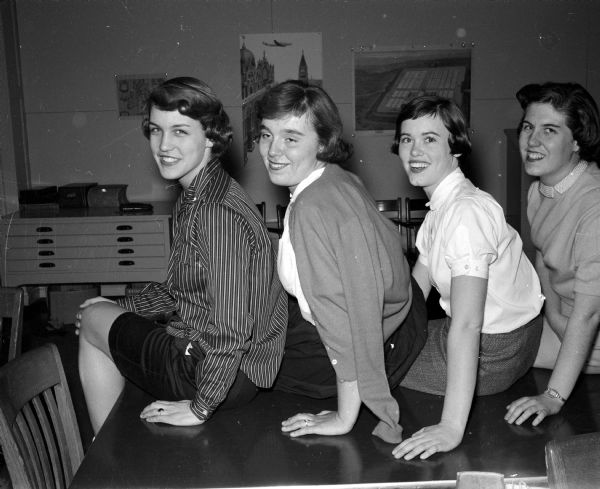 Portrait of four chairmen who headed preparations for a formal dance sponsored by Philomathia, a service club at Wisconsin High School. They include, from left, Marilyn Tormey, 68 Cambridge Road, publicity; Judy Lease, 1634 Sherman Avenue, tickets; Mary Ellen Lathers, 105 Fisk Place, orchestra and Gill Wolff, 3006 Harvard Drive, decorations.